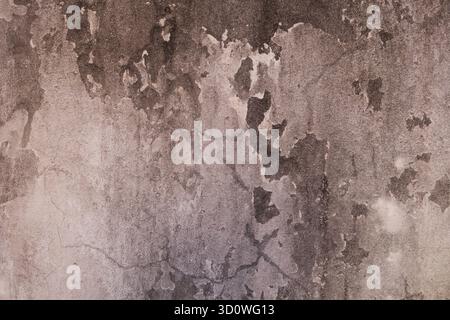 Old weathered concrete wall with peeling paint texture, vintage grunge background for urban design Stock Photo
