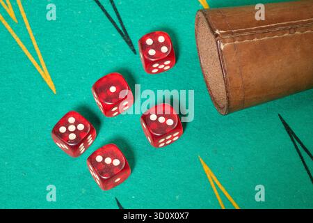Red dices on green background Stock Photo
