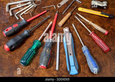 Set of different kind of hand tools on brown wooden table Stock Photo