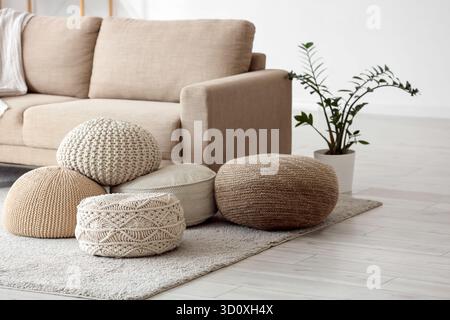 Different poufs on carpet in living room interior Stock Photo