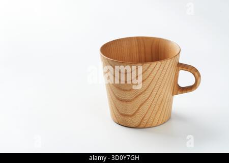 A beautiful mug made of wood on a white background with blank side Stock Photo