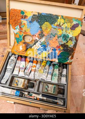 closeup of artists wooden paintbox and palette Stock Photo