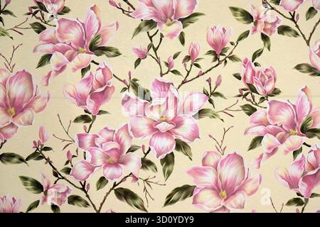 Beige wallpaper with pink magnolia flowers. Floral wallpaper with a patterned background, vinyl wallpaper for walls. Stock Photo