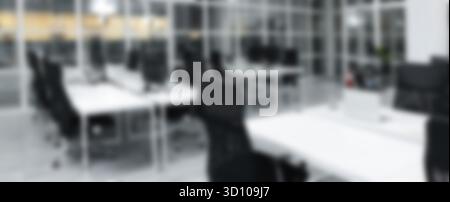 Tables and chairs in office, blurred view Stock Photo