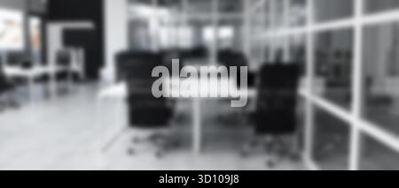 Tables and chairs in office, blurred view Stock Photo