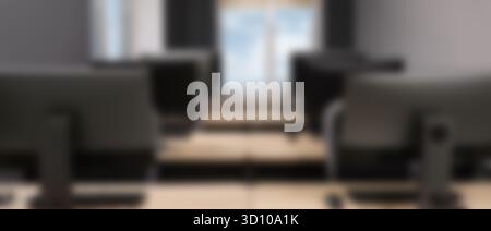 Tables and computers in office, blurred view Stock Photo