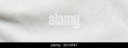 Cream-colored fabric texture with subtle weave pattern perfect for design and fashion projects. Stock Photo