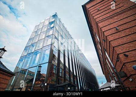Oslo, Norway - September 8, 2025: Terminalbygget Stranden 1 building's glass facade in Aker Brygge designed by Ghilardi Hellsten Arkitekter Stock Photo