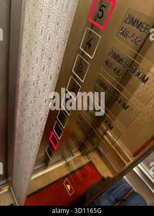 Elevator panel in a hotel with illuminated floor buttons and reflective surfaces. Symbol of travel navigation architecture and modern lifestyle in urb Stock Photo