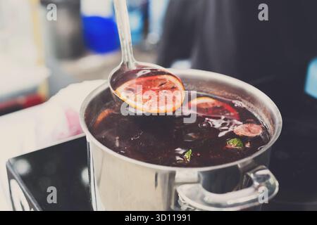 Making mulled wine for sale at country fair Stock Photo