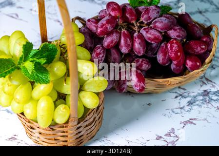 Red and green grapes in a bowl Stock Photo