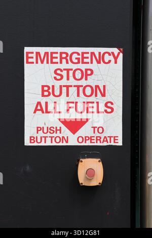 Emergency Stop Button All Fuels sign at a petrol gas service station Stock Photo