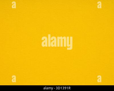 Bright yellow paper texture conveys joy and stimulates creative and energetic moods Stock Photo