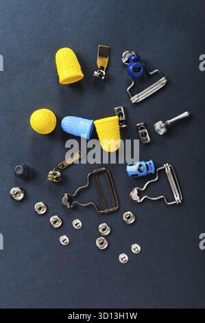 Thimble and sewing pins on dark backdround Stock Photo