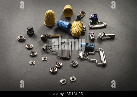 Thimble and sewing pins on dark backdround Stock Photo
