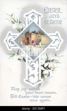 An embossed Easter card features a central cross design overlaid with a diamond-shaped illustration depicting a Middle Eastern street scene with figures in robes. The border is decorated with clusters of white snowdrop flowers. A printed verse reads, "Easter Joys Be Thine" and "May joy within your heart remain, Till Easter-tide comes once again." From an original embossed greetings postcard published by B.B. of London. Stock Photo
