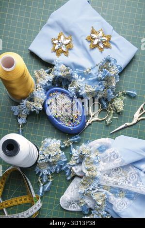 Set for handiwork: Scissors, thread, pins, centimeter, needles, ornaments Stock Photo