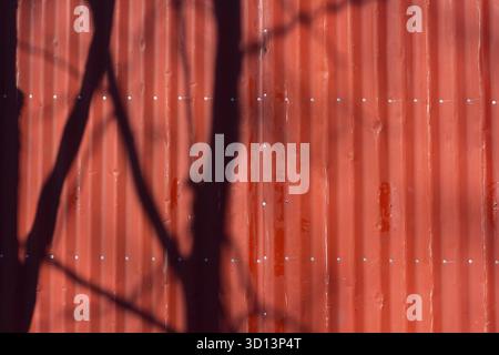 Red metal tile texture. The texture is red. Red wall Stock Photo