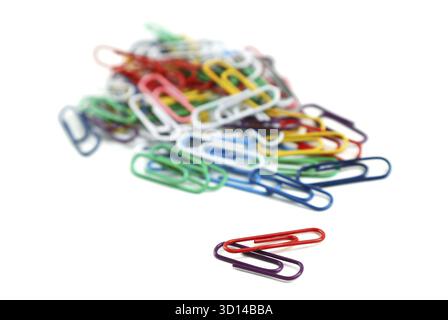 Colored paper clips on a white background Stock Photo