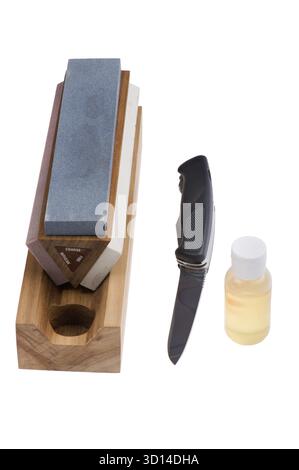 Object on white - Sharpener stone and knife Stock Photo