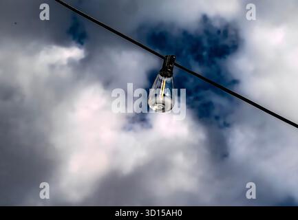 Outdoor patio light against an autumn sky Stock Photo