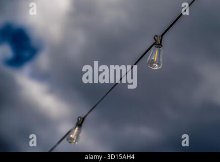Outdoor patio light against an autumn sky Stock Photo