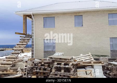 The house is made of yellow silicate brick. The walls and facade of the house are made of brick Stock Photo