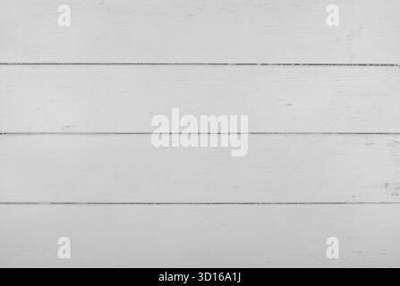 White painted wooden planks are creating a beautiful rustic background texture, perfect for design projects and adding a touch of vintage charm Stock Photo