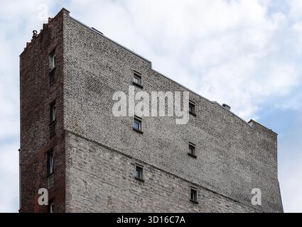 Old Parisian building made of brick and stone, France Stock Photo