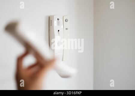 white intercom on the wall Stock Photo