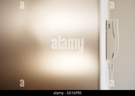 white intercom on the wall Stock Photo