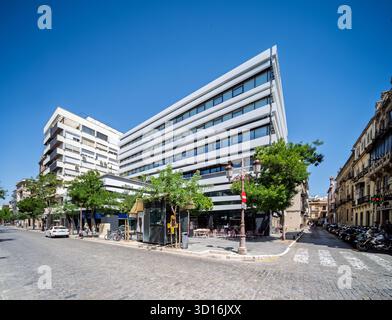 In central Seville, Edificio Villasís features modern design with white lines and balconies, home to creative professionals and vibrant coworking spac Stock Photo