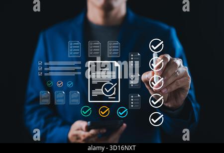 Businessman checking off digital checklist and documents on virtual interface. Perfect for task management, workflow process, productivity, audit, Stock Photo