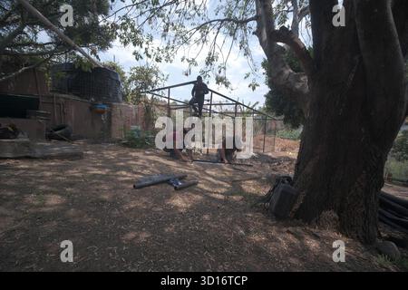 Blacksmiths working outdoors on a very simple structure Stock Photo