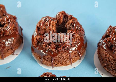 Chocolate cake brioche doughnuts gourmet hand made closeup. Stock Photo
