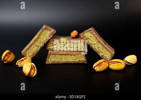 Luxurious pistachio chocolate sweets in a stacked arrangement, showing premium dessert detail and food texture.  Stock Photo