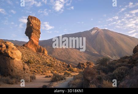 Roque Cinchado rises majestically backdroped by Mount Teide in peaceful Canadas del Teide National Park, Tenerife, Spain Stock Photo