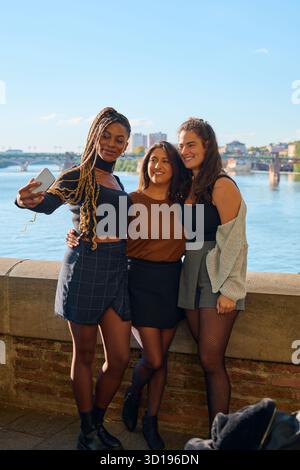 Diverse women friends taking selfie in toulouse Stock Photo