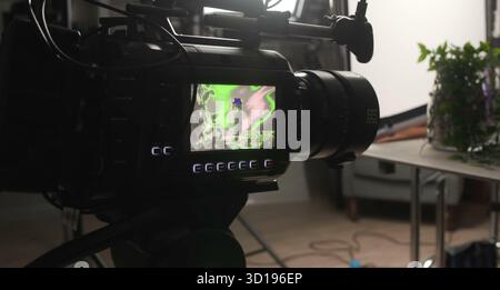A professional cinema camera captures vibrant product visuals on its. Stock Photo
