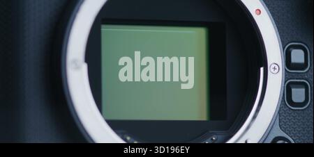 The camera sensor is revealed, showcasing its delicate internal. Stock Photo
