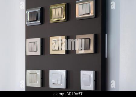 Various electrical switches on the stand in the store. Industry Stock Photo