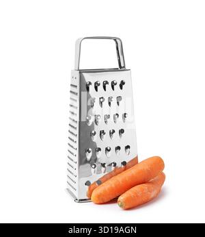 Grater and raw carrots isolated on white Stock Photo