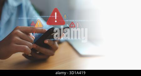 Person holding smartphone with digital warning alerts and binary code background, representing data breach, cybersecurity threat, and mobile security Stock Photo
