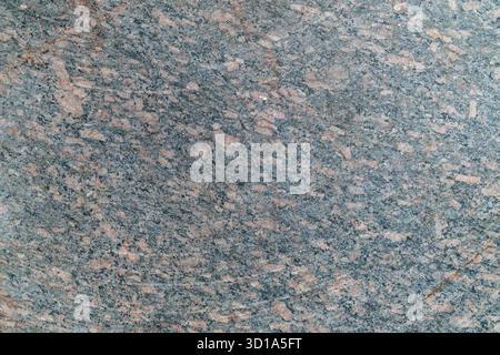 Granite surface texture with speckled gray and pink patterns. Stock Photo