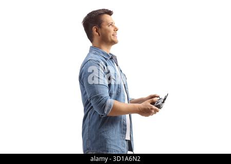 Man holding a drone remote cotroller isolated on white background Stock Photo
