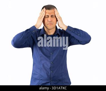 Portrait of hispanic man isolated on white background, suffering from severe headache, pressing fingers to temples with closed eyes Stock Photo