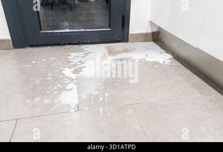 Close up of milk stains on grey floor Stock Photo