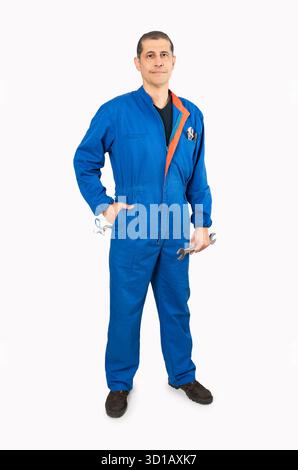 Full length portrait of a mature male worker in an overall uniform posing and smiling isolated on white background Stock Photo