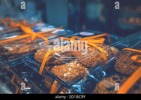 Fresh oatmeal cookies in holiday packaging on display at a large store Stock Photo