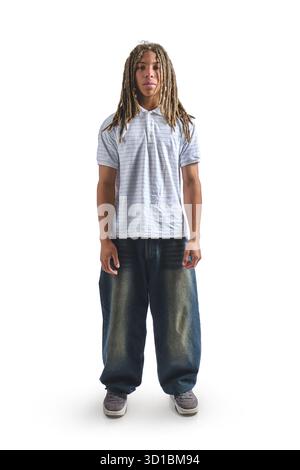 Young man with long dreadlocks and serious expression posing in a studio Stock Photo
